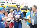 May 26, 2018: Monster Energy NASCAR Cup Series driver Kyle Busch (18) signing autographs for fans, while walking out to qualifying for the Alsco 300. Concord, NC Jonathan Huff/CSM