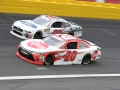 May 26, 2018: NASCAR Xfinity Series drivers Christopher Bell (20) and Chase Briscoe (98) race of turn four during the Alsco 300. Concord, NC  Jonathan Huff/CSM