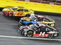 May 27, 2018: Monster Energy NASCAR Cup Series drivers Clint Bowyer (14), Martin Truex Jr. (78), and Joey Logano (22) race three wide off of turn four during the Coca-Cola 600 in Concord, NC.  Jonathan Huff/CSM