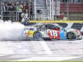 May 27, 2018: Monster Energy NASCAR Cup Series driver Kyle Busch (18) wins the Coca-Cola 600 in Concord, NC.  Jonathan Huff/CSM