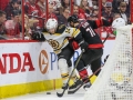 May 14, 2019: Boston Bruins right wing Chris Wagner (14) tries to clear the puck during game 3 of the NHL Eastern Conference Championship series between the Boston Bruins and the Carolina Hurricanes held at PNC Arena in Raleigh, NC. Boston defeats Carolina 2-1. Jonathan Huff/CSM