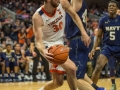 December  29, 2019: Virginia Cavaliers forward Jay Huff (30) works to keep a play alive during NCAA basketball action between the Navy Midshipmen and the Virginia Cavaliers at John Paul Jones Arena Charlottesville, VA. Jonathan Huff/CSM