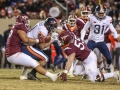 November 23, 2018: Virginia Cavaliers running back Jordan Ellis (1) is tackled by Virginia Tech Hokies defensive linemen Ricky Walker (25) and Jarrod Hewitt (55) during NCAA football action between the Virginia Cavaliers and the Virginia Tech Hokies at Lane Stadium in Blacksburg, VA. Jonathan Huff/CSM