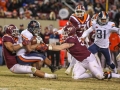 November 23, 2018: Virginia Cavaliers running back Jordan Ellis (1) is tackled by Virginia Tech Hokies defensive linemen Ricky Walker (25) and Jarrod Hewitt (55) during NCAA football action between the Virginia Cavaliers and the Virginia Tech Hokies at Lane Stadium in Blacksburg, VA. Jonathan Huff/CSM
