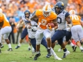 September 1, 2018:Tennessee Volunteers running back Tim Jordan (9) tries to escape West Virginia defenders during NCAA football action between the West Virginia Mountaineers and the Tennessee Volunteers at the Belk College Kickoff at Bank of America Stadium in Charlotte, NC. West Virginia defeated Tennessee 40-14. Jonathan Huff/CSM