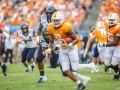 September 1, 2018:Tennessee Volunteers running back Tim Jordan (9) tries to escape West Virginia defenders during NCAA football action between the West Virginia Mountaineers and the Tennessee Volunteers at the Belk College Kickoff at Bank of America Stadium in Charlotte, NC. West Virginia defeated Tennessee 40-14. Jonathan Huff/CSM