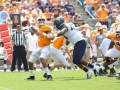 September 1, 2018: Tennessee Volunteers quarterback Jarrett Guarantano (2) sacked by West Virginia Mountaineers defensive lineman Kenny Bigelow Jr. (40) during NCAA football action between the West Virginia Mountaineers and the Tennessee Volunteers at the Belk College Kickoff at Bank of America Stadium in Charlotte, NC. Jonathan Huff/CSM