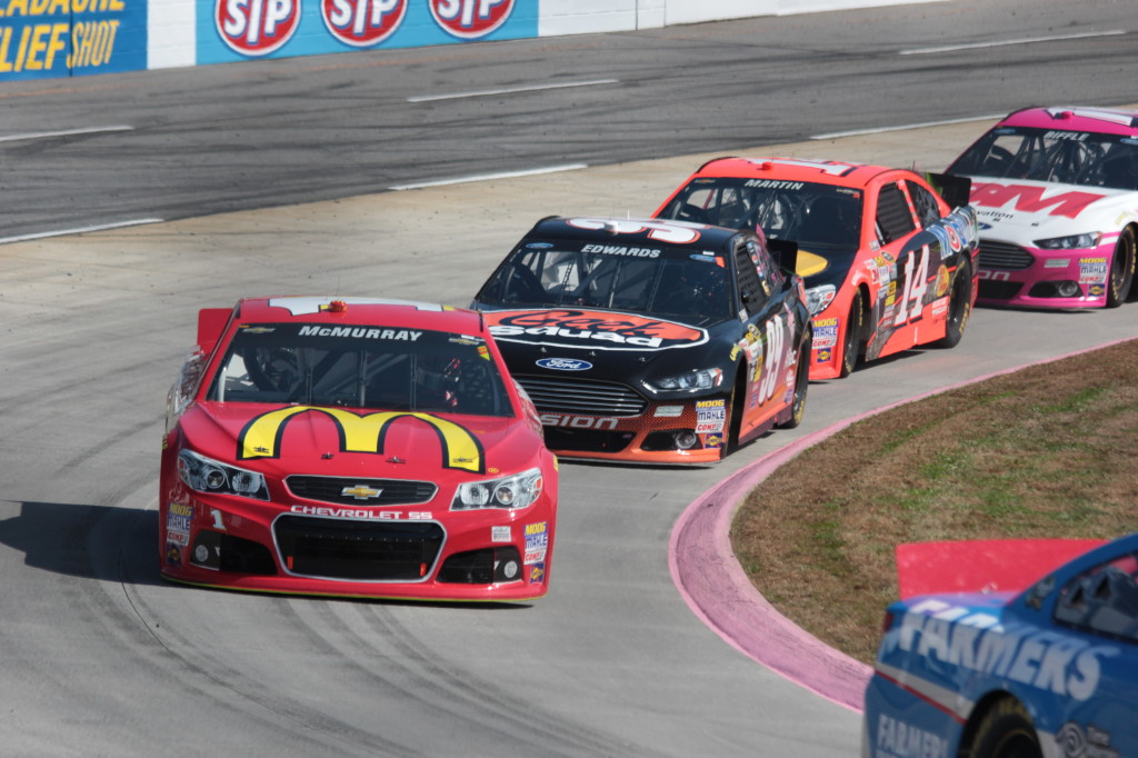 Racing off turn four